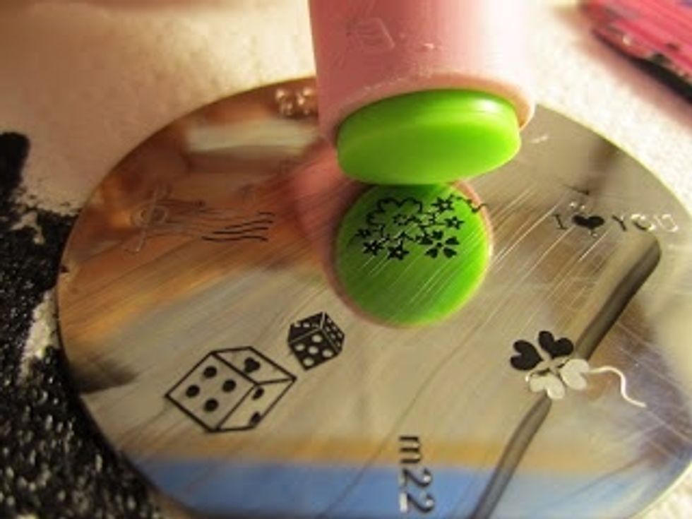 Press the stamper into the painted image.