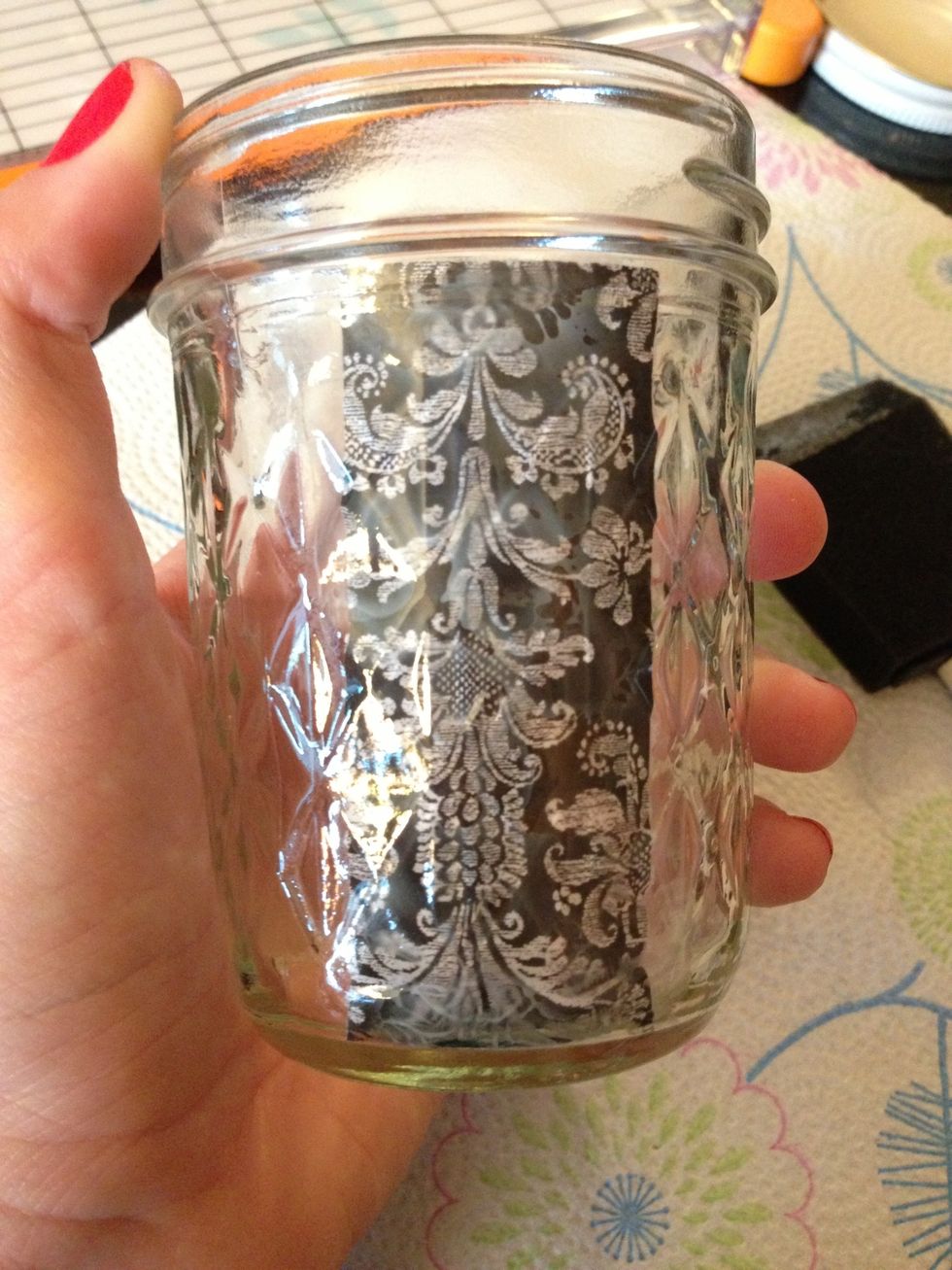 Press the strip on the inside if the jar as shown. For taller jars use a ruler to flatten out the bottom if you are unable to reach it.