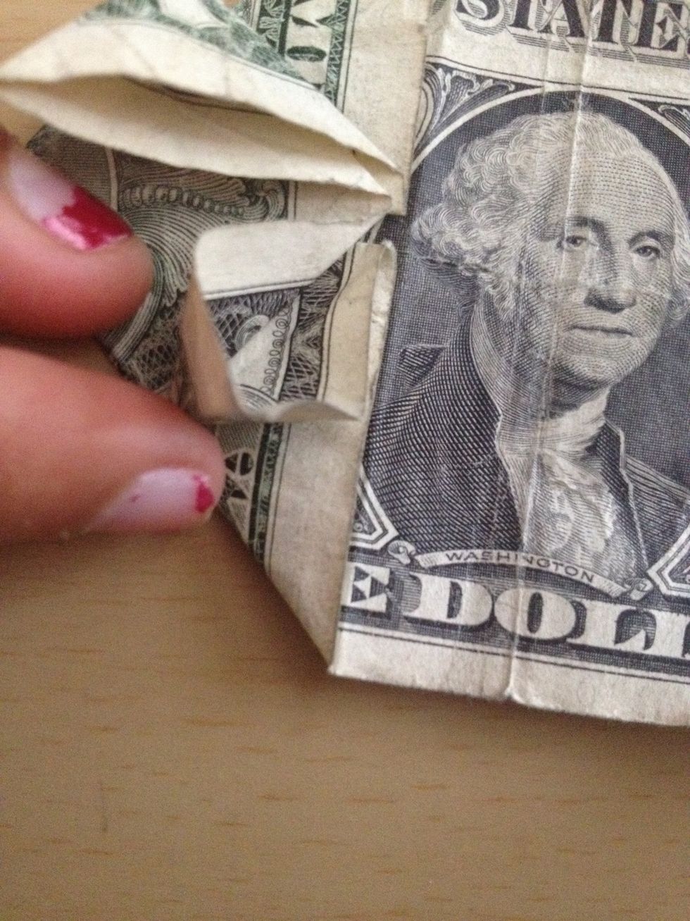 Press the top point of open it up (do on BOTH halves of the dollar).