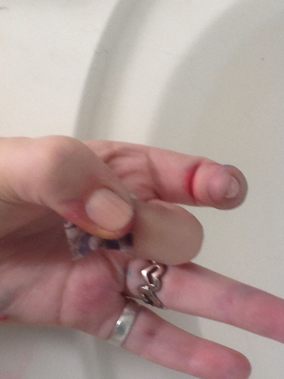 Press the wet newspape onto your nail FIRMLY for 15-30 seconds