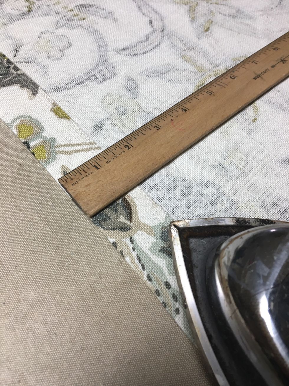 Press up 1 1/2" along bottom edge of PILLOW BACK.