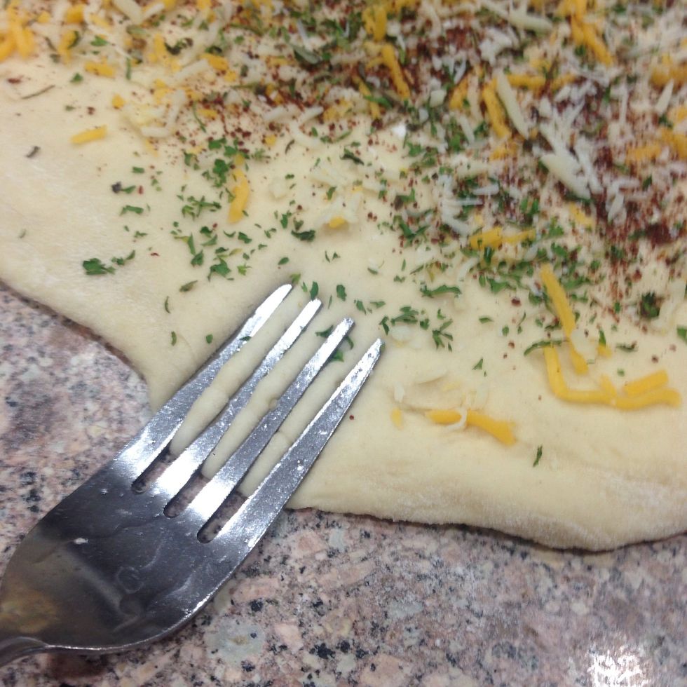 Press with fork on one long edge of the rectangle and brush with water to help sealing it.