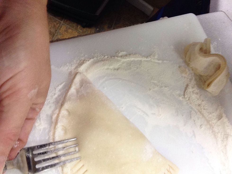 Press with fork to seal edge and cut small slits in top to vent pie.