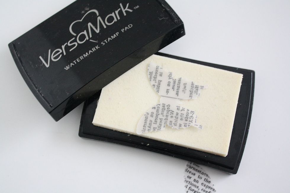 Press your butterfly face down onto VersaMark Stamp Pad. Be sure to get full coverage