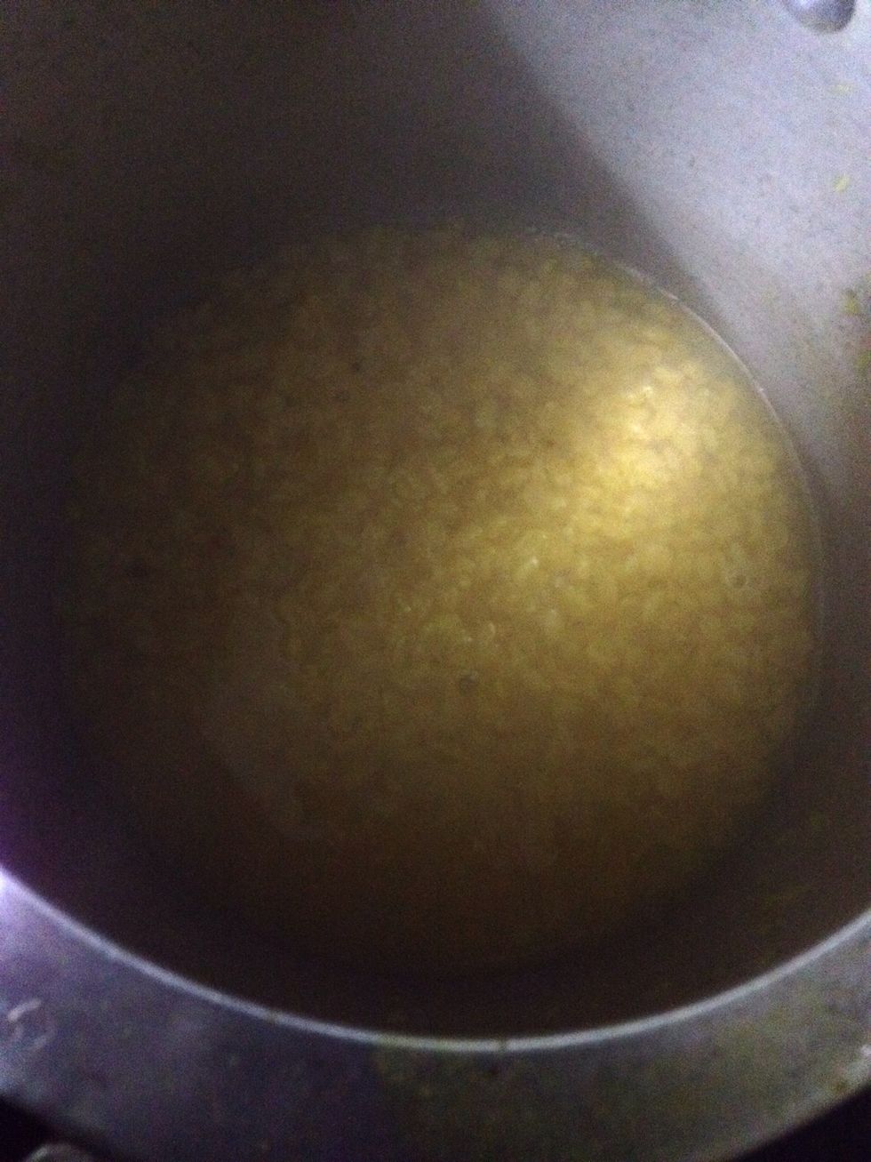 Pressure cook lentils with turmeric powder
