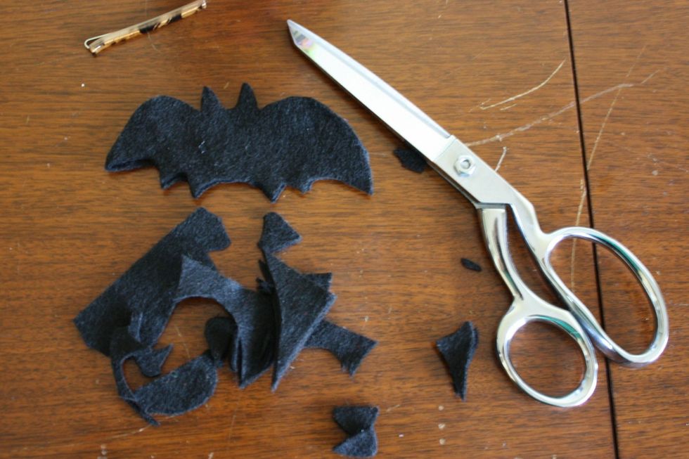 Pretend you're Edward Scissorhands and cut out a bat shape from a piece of felt that is folded in half. You should end up with two bats.