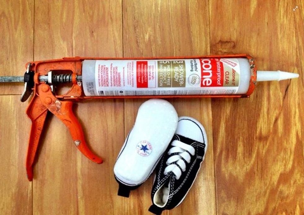 Pretty simple,  zig zag a small bead of caulk on the bottom of the soles of your kids shoes and with your gloves on smoothen out the bead so it's flat and even.