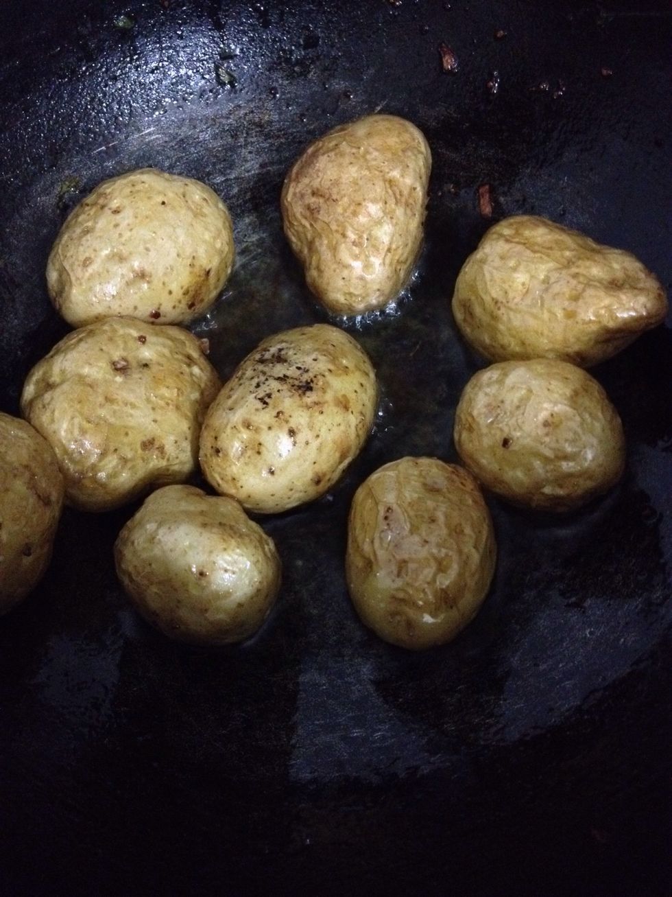 Prick potatoes and keep in salt water for 15 min . The dry it on paper towel and shallow fry the potatoes in oil