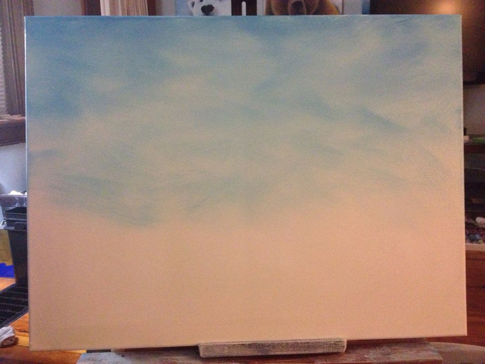Prime canvas as usual. Then take blue and white on your chip brush and make little X patterns halfway down to make your sky.
