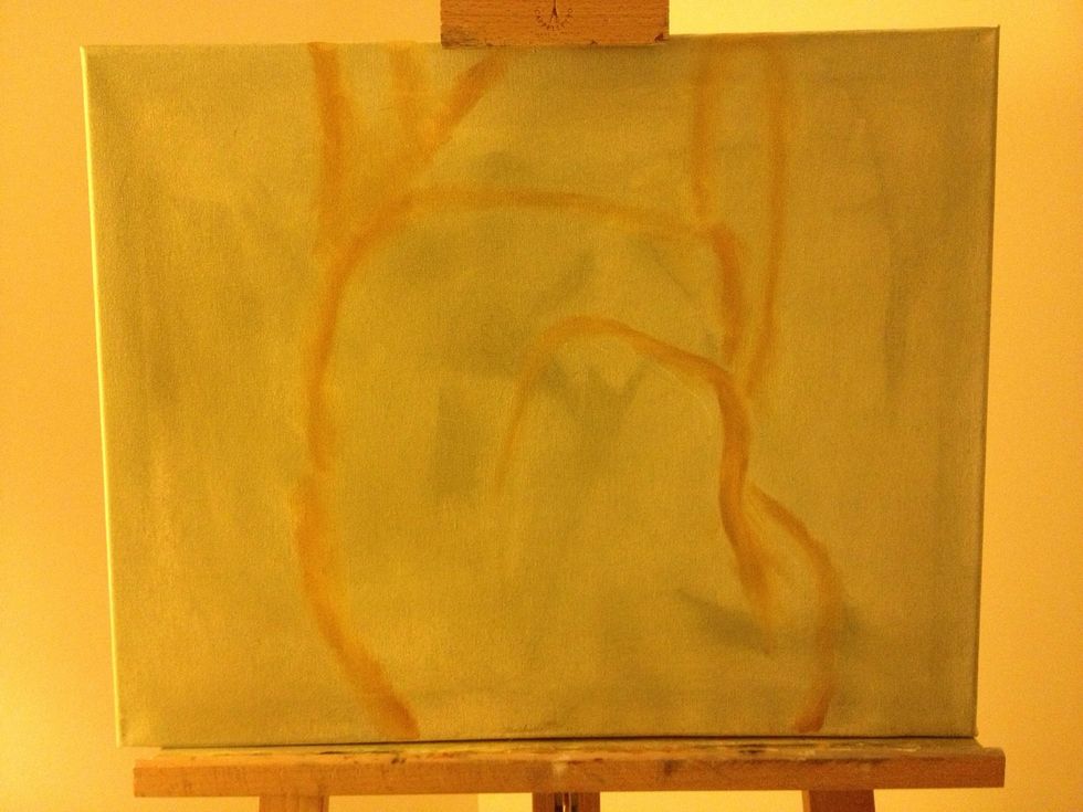 Prime the canvas with a mixture of white, yellow, and a dab of black oil paint. Spread it very thin along the entire canvas. Outline brownie with some Yellow Ochre.