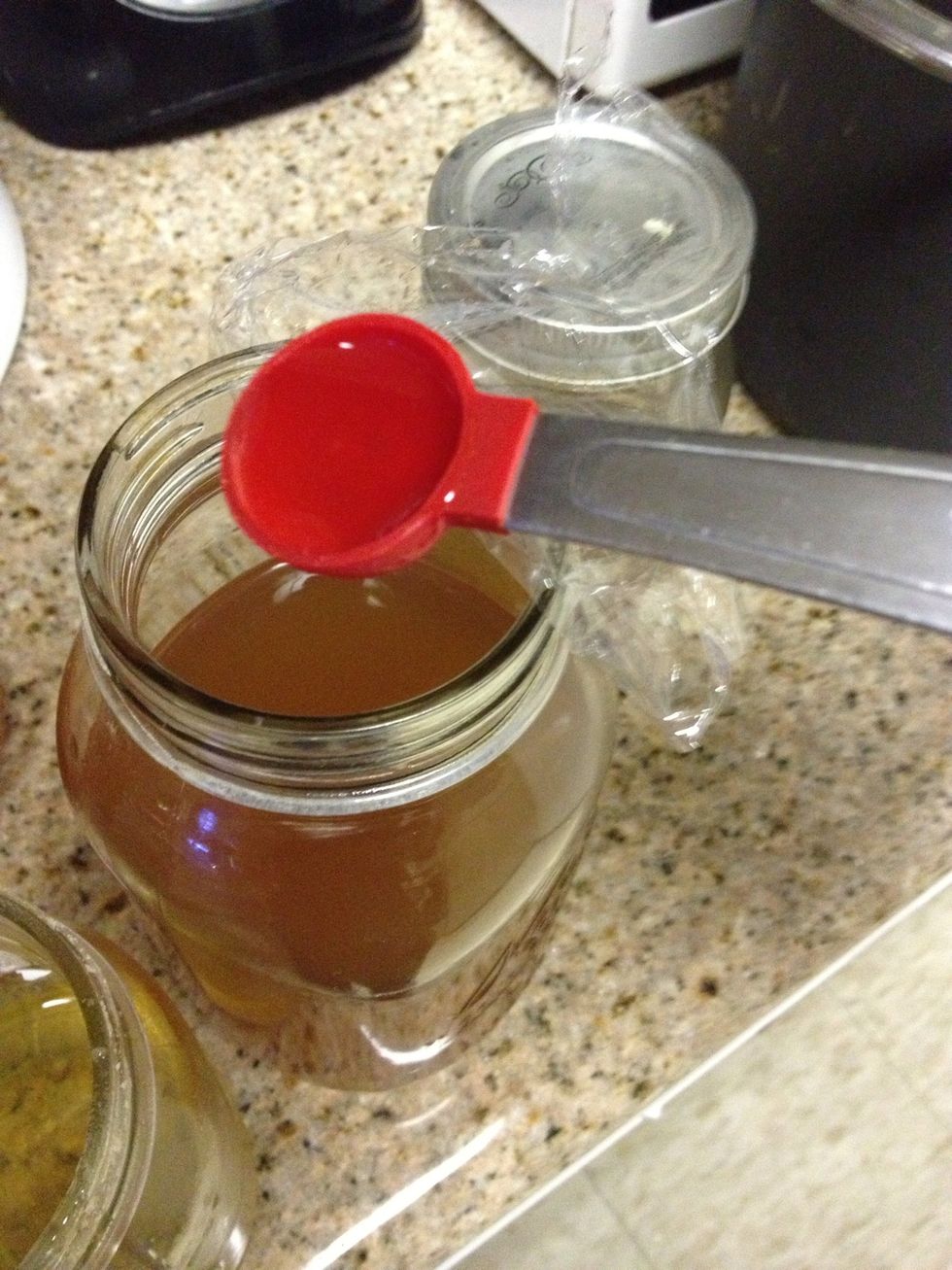 Priming sugar, this increases the carbonation. You can use fruit or vege juices, I'm using an orange infused simple syrup 1 tsp per 16 oz. Add plastic wrap around metal lids kombucha is acidic