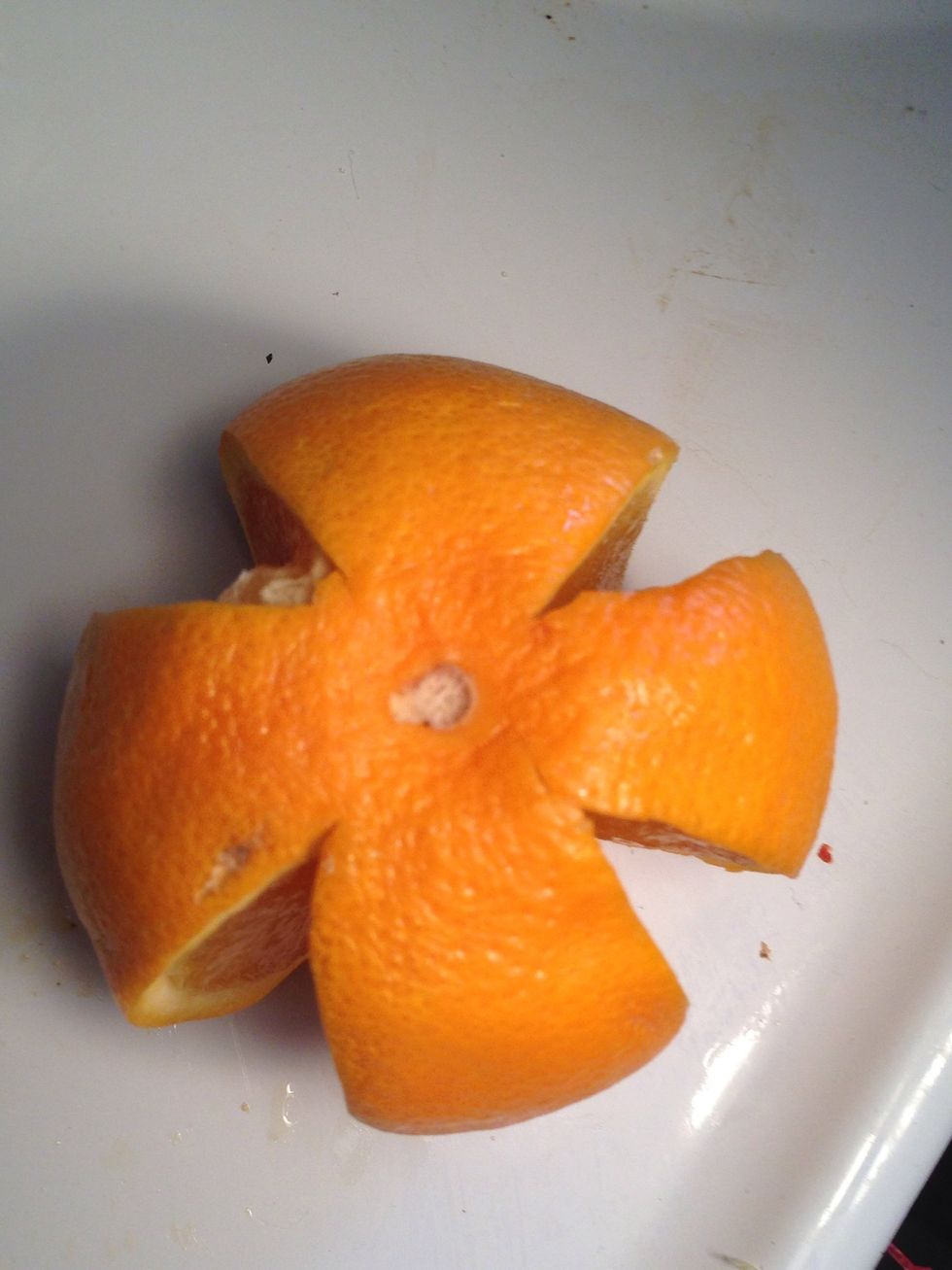 Proceed to slice the orange into 6 even slices.