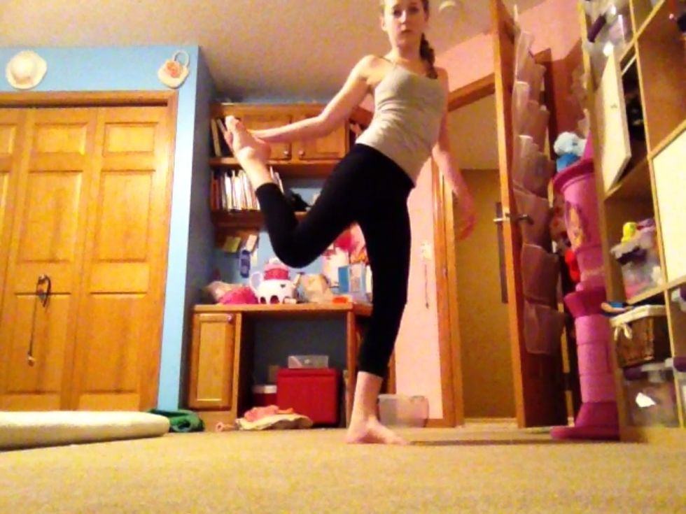 Process of scorpion ... Start by grabbing your foot with one hand as shown