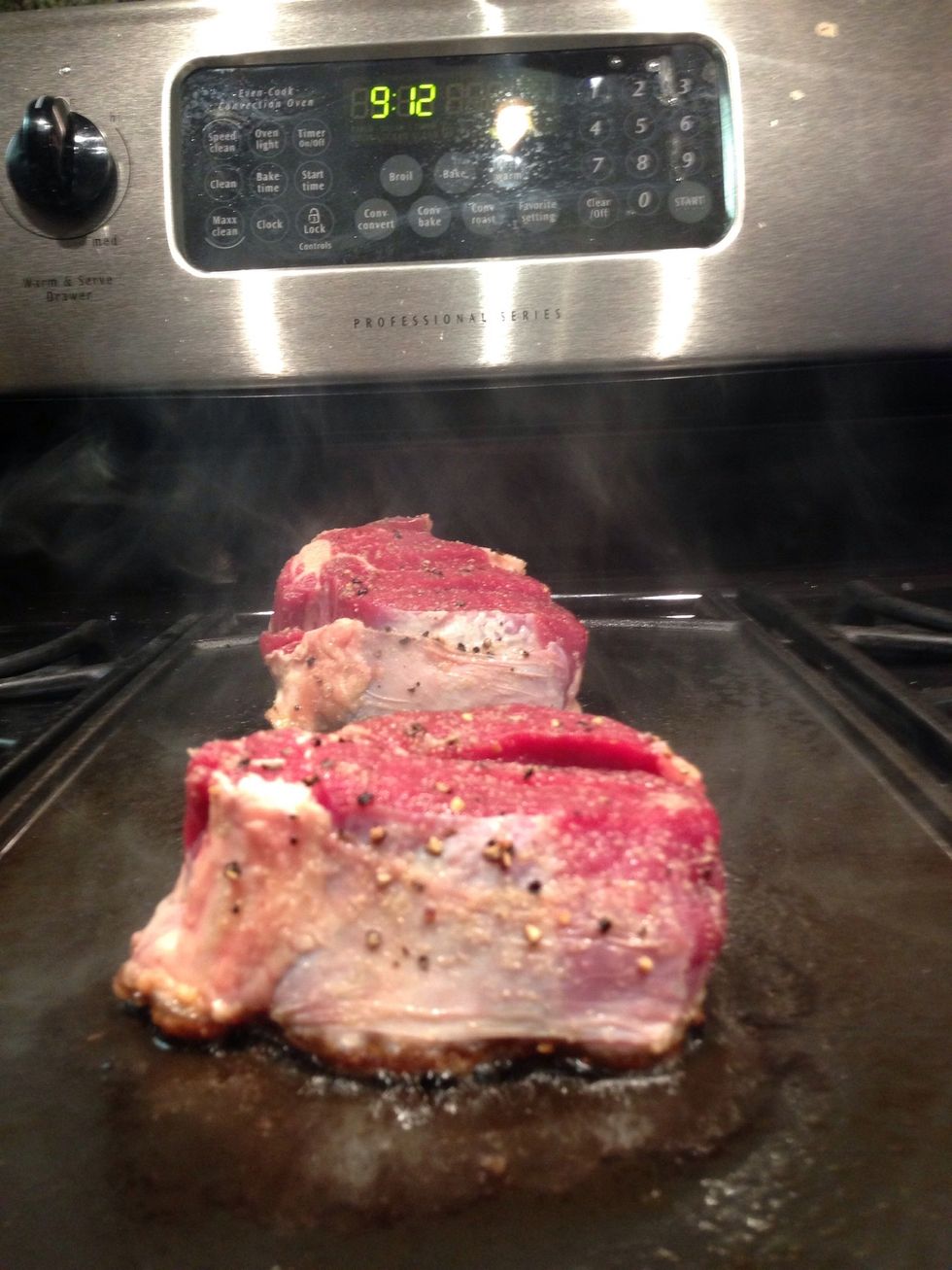 Proper seasoning, room temperature meat, extremely high heat and not moving the steak are crucial to getting the proper sear and outer crust. Judging doneness from poking the steak takes practice.