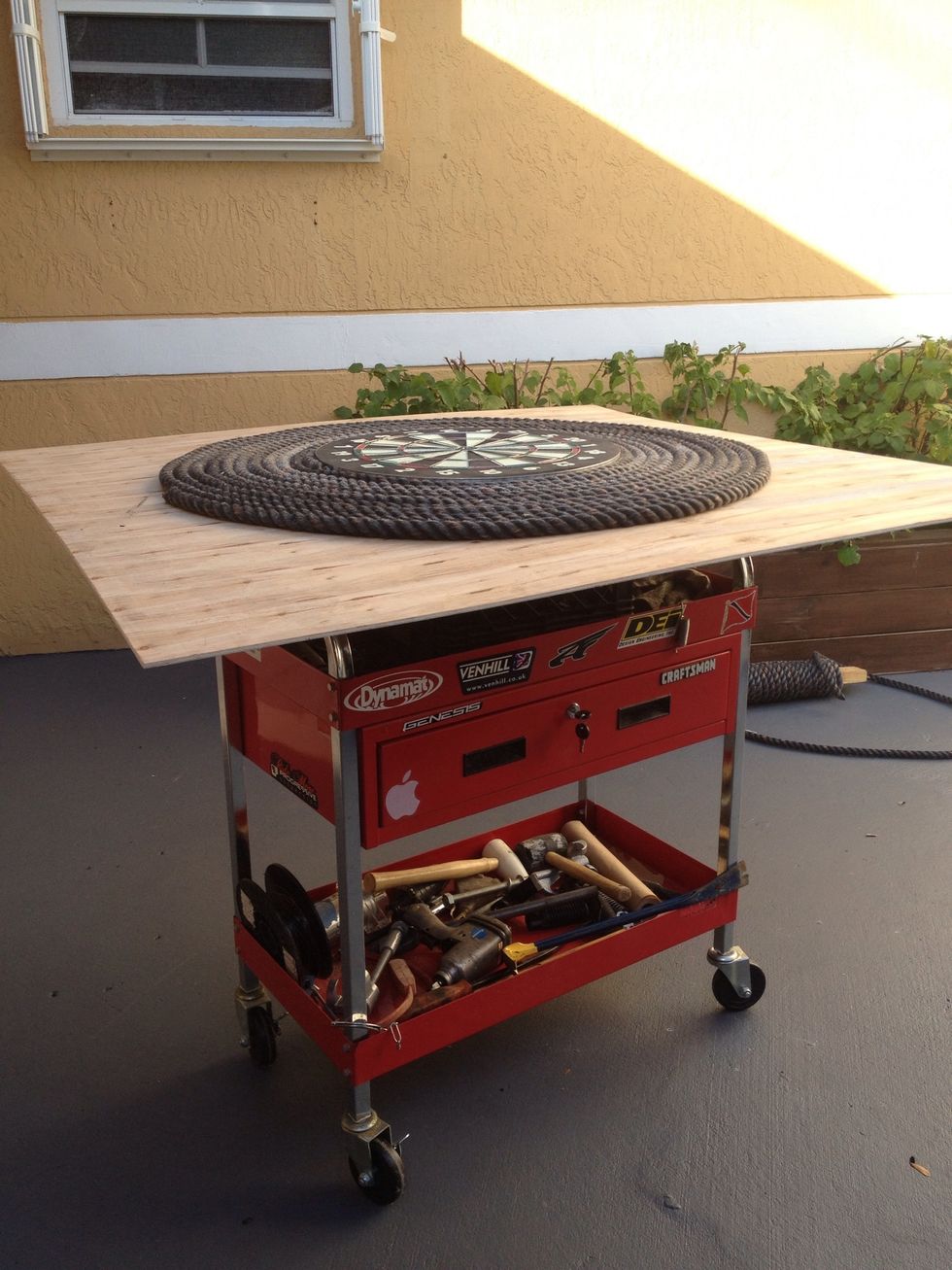 Propped the board up on a milk crate so I could use a jig saw to cut off the excess wood