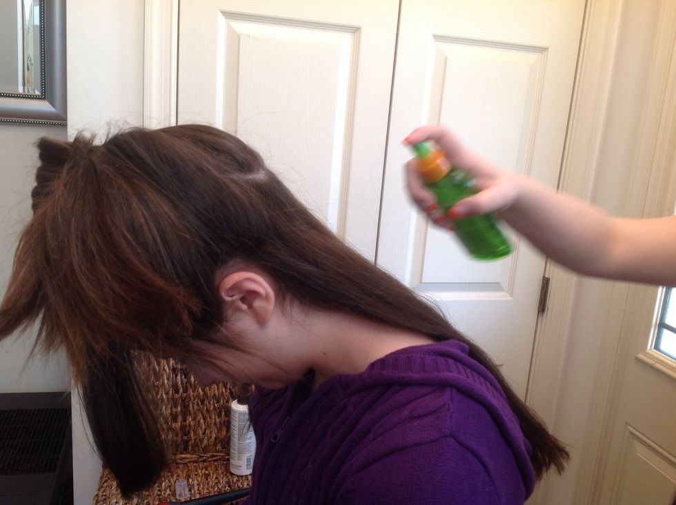 Protecting the Hair: Spray the first section of hair with a light amount of heat protectant spray. The hair should be fully coated, without being completely damp.