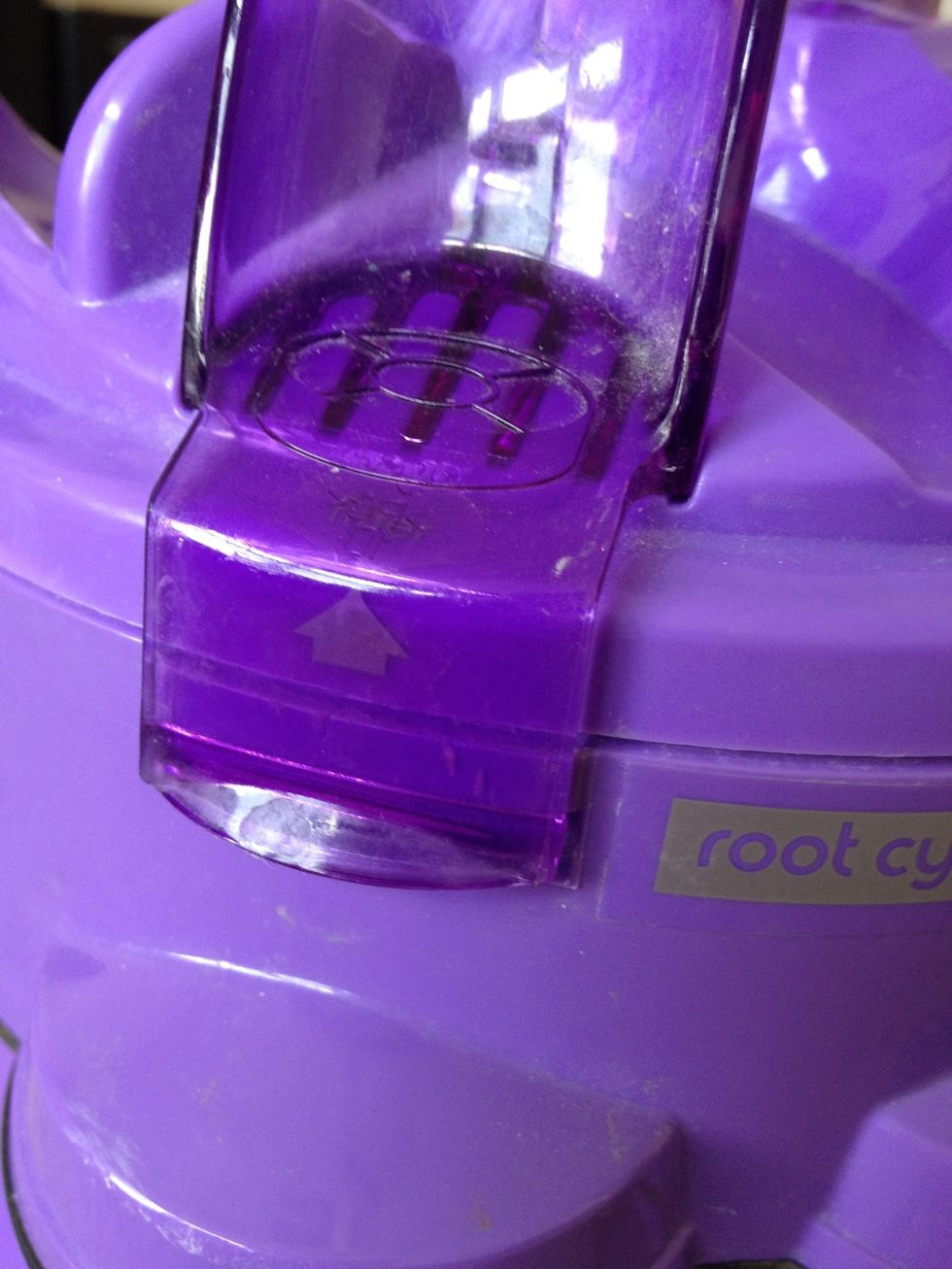 Pry open the lid on the top here to get to the filter.