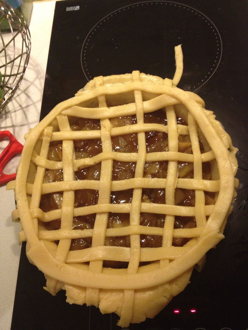 Pu the last strip on the rim of the pie.