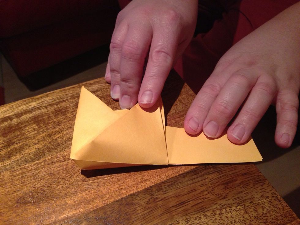 Pull across the 2 legs to meet ( see video ) and make sure all the edges are aligned.