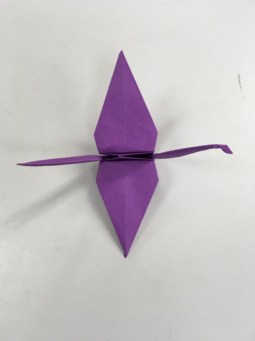 Pull apart the larger triangles which are now the wings.