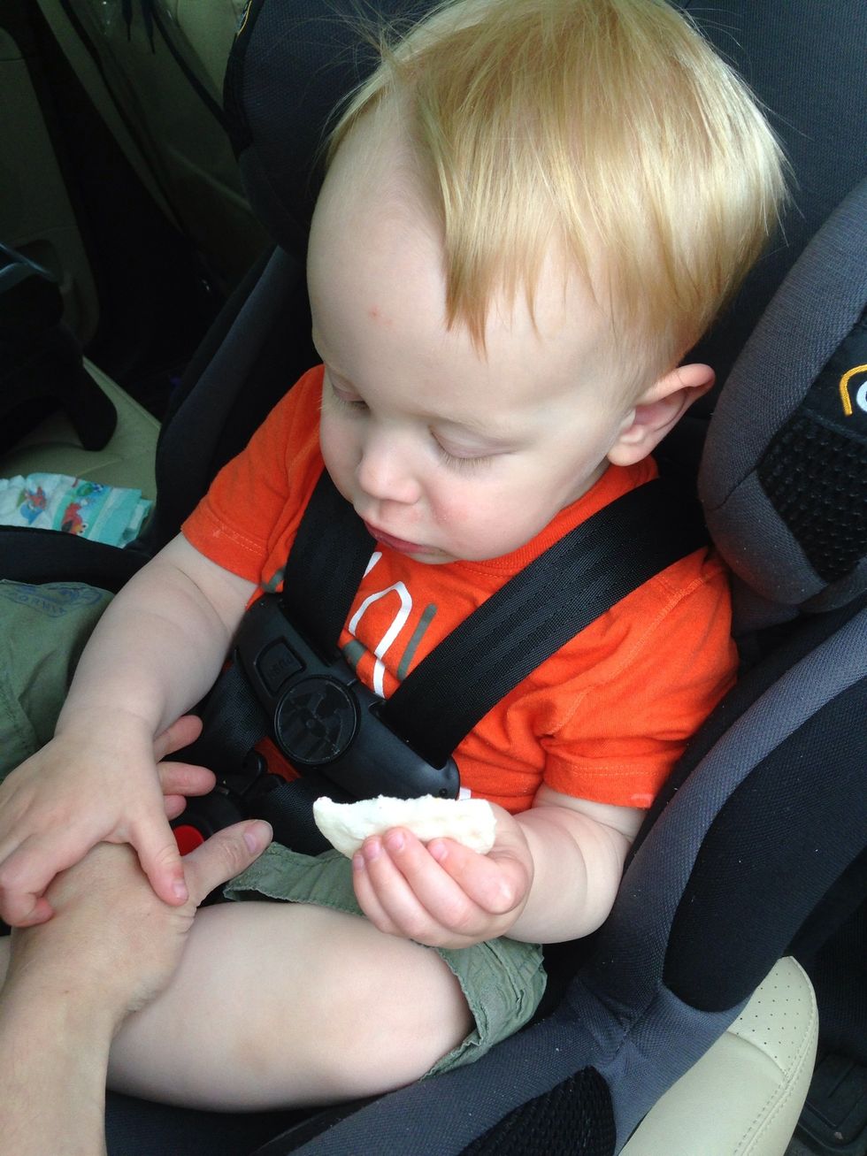 Pull chest clip down to crotch buckle