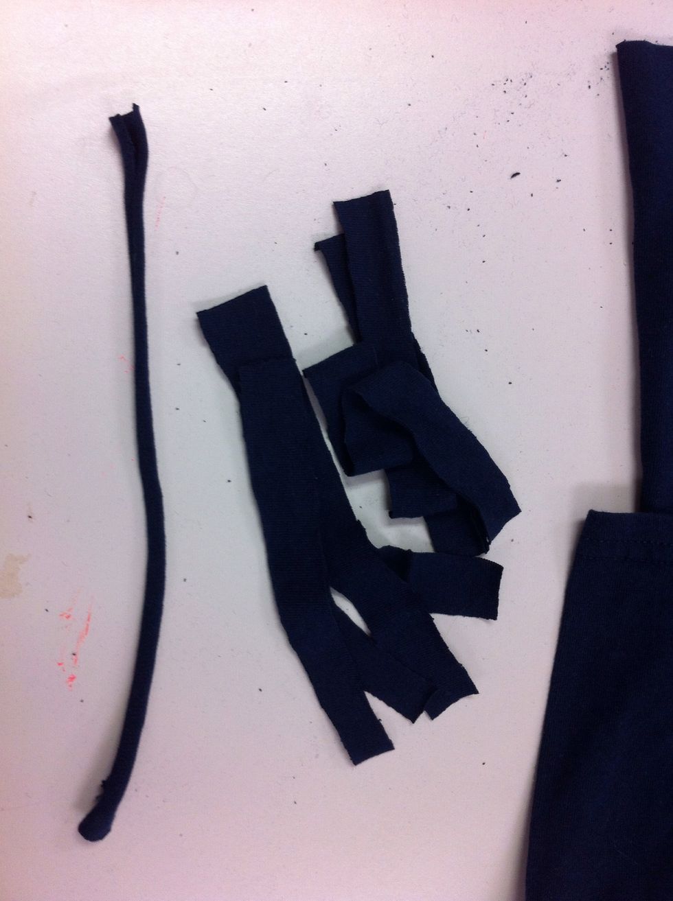 Pull each end of the strip and stretch it. This rolls the rough edges to the inside.