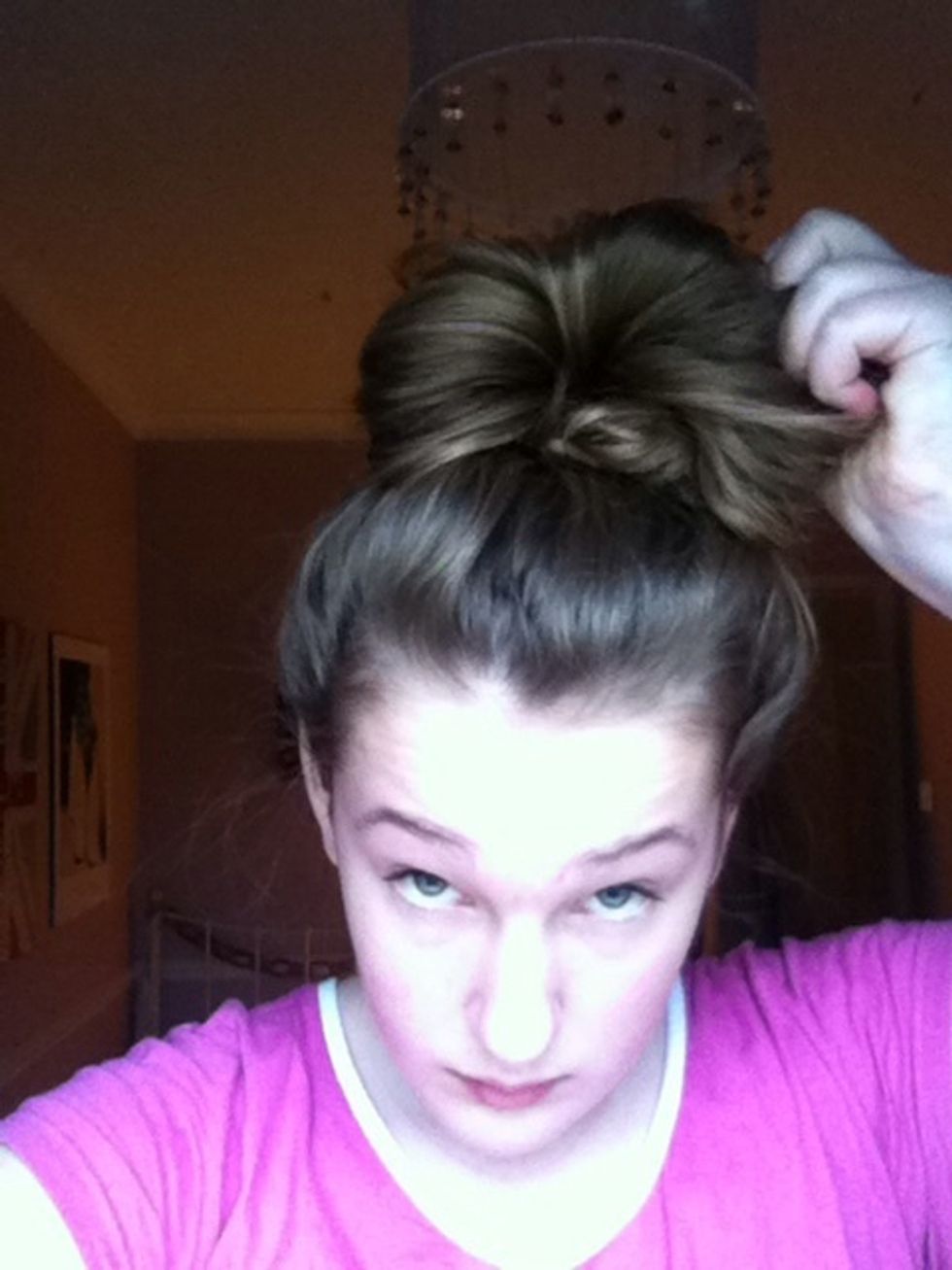 Pull either side of your bun using 2 hands! Until it has a big shape like this.