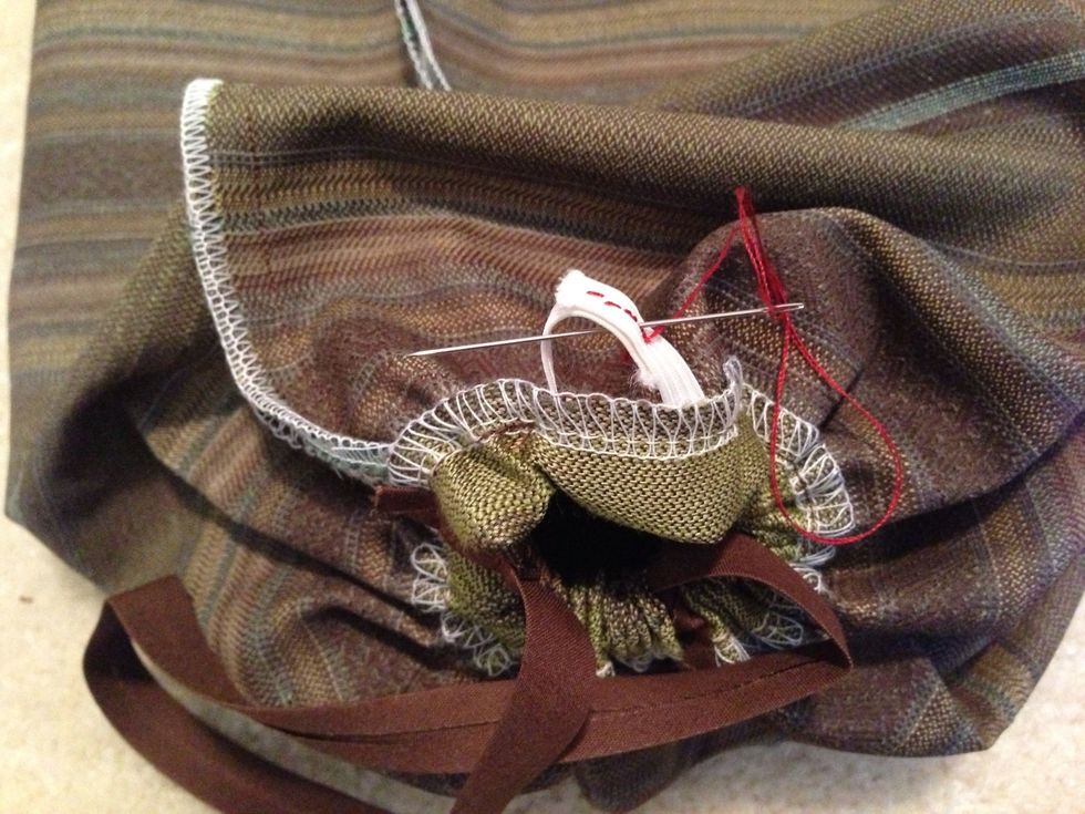 Pull elastic ends & hand stitch together. Once done, you're finish. Invert your tube & enjoy.