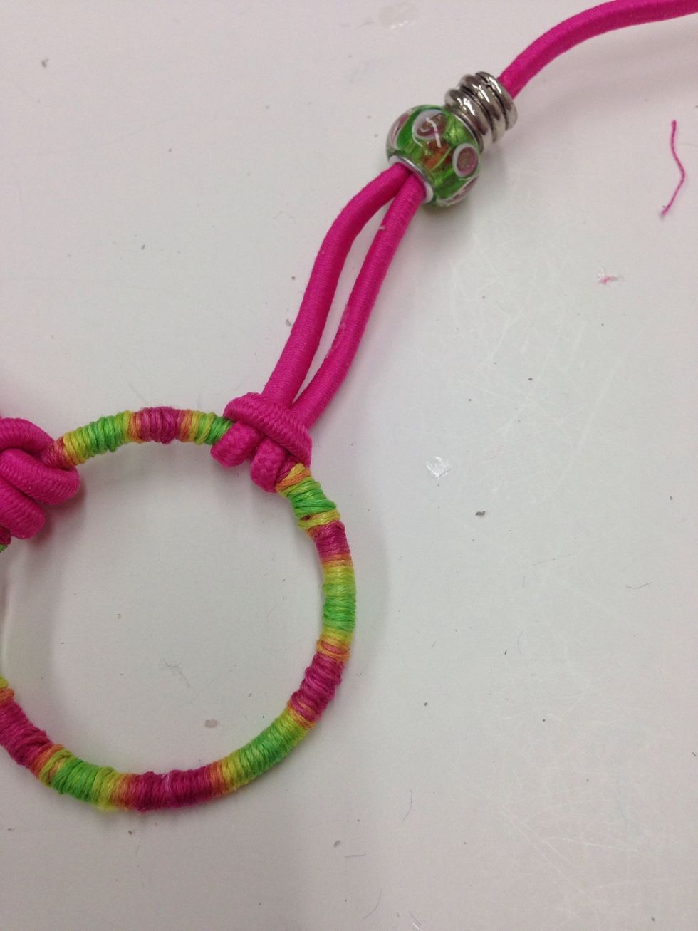 Pull gently on the cord to snug the looped knot into place. Repeat steps 29-32 with the second cord.