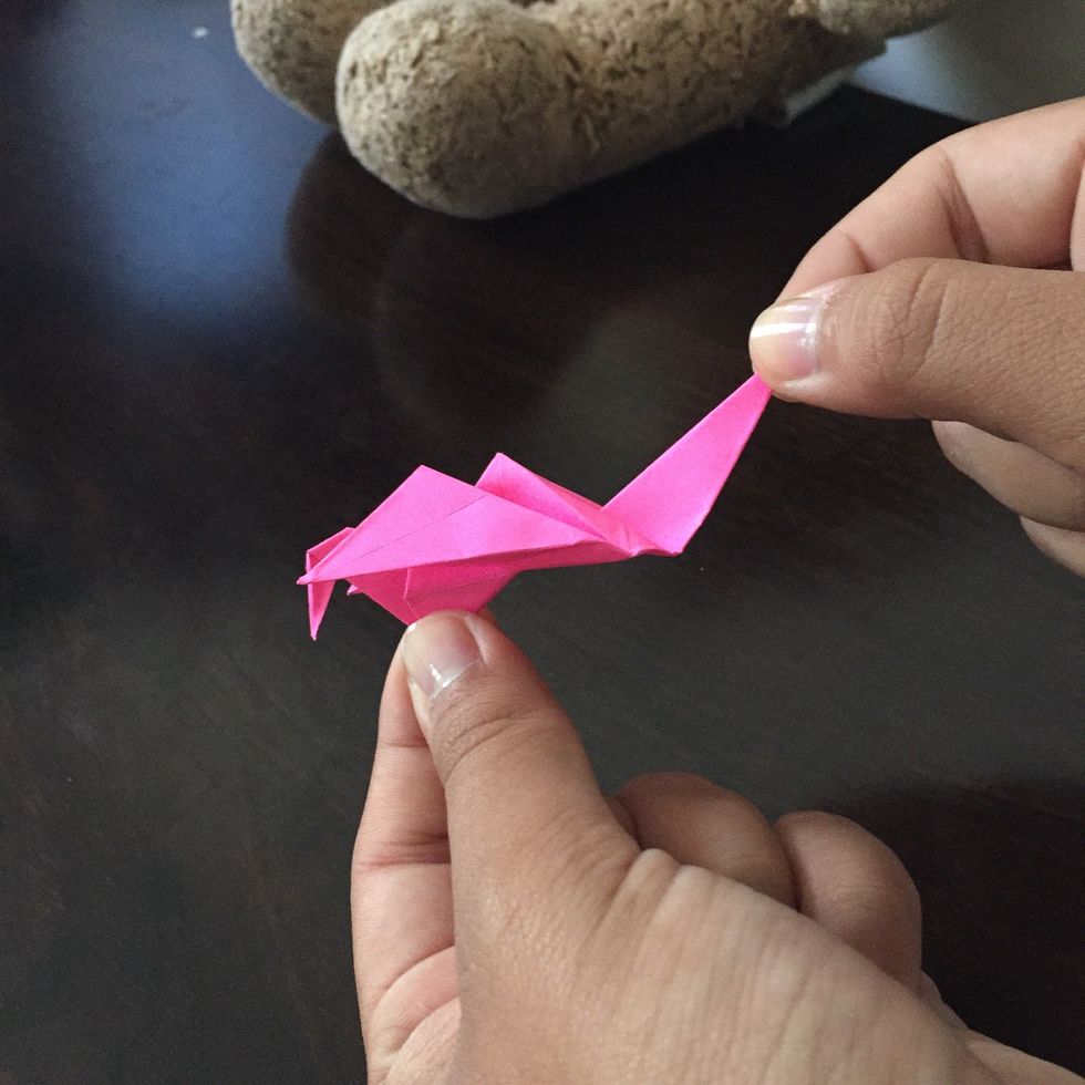 Pull gently on the tail to make the wings flap.