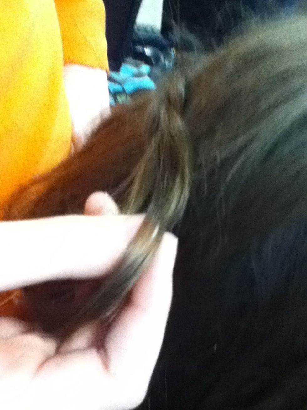 Pull hair to back of head