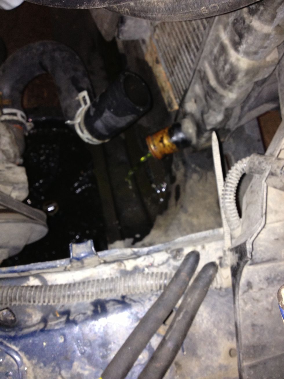 Pull hose to drain coolant from radiator