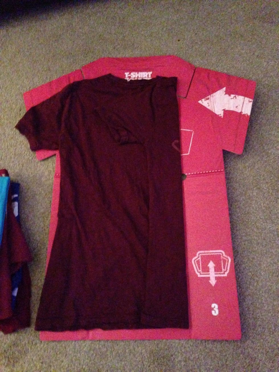 Pull it back, leaving the T-Shirt sleeve folded.