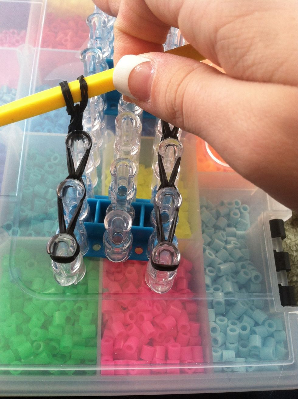 Pull it off the loom and make sure it's far enough on the hook so it won't fall off and come unlooped.