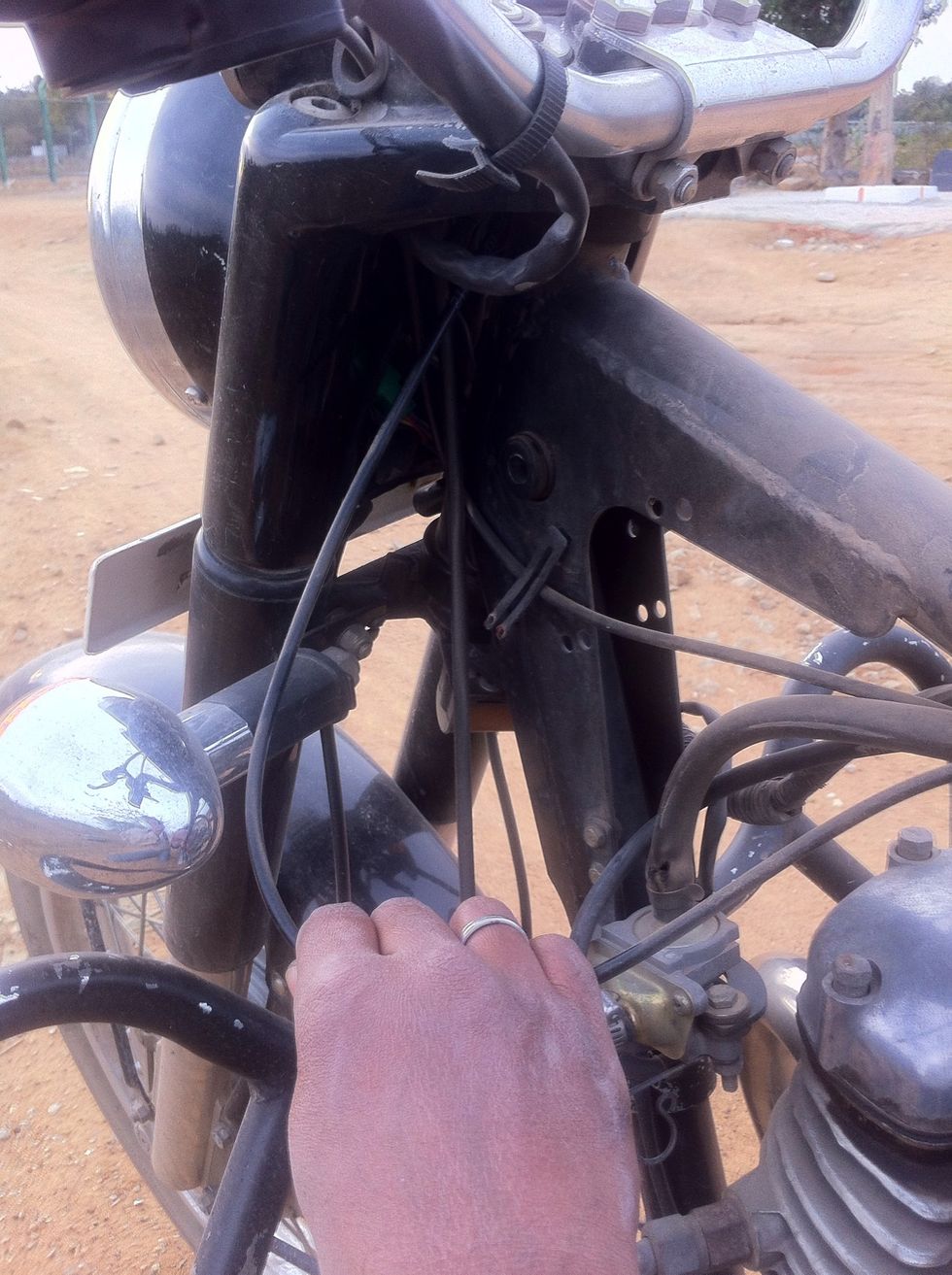 Pull it out until it frees from the headlamp casing.