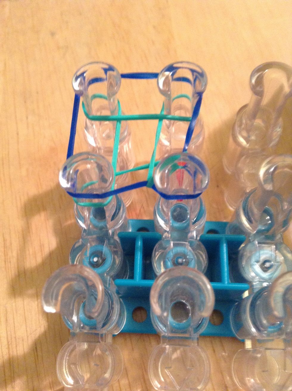 Pull it over the peg and into the middle