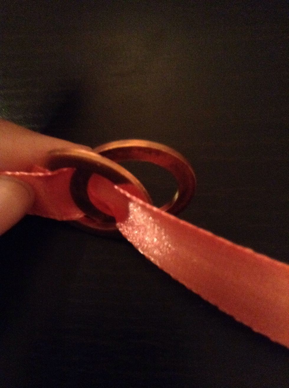 Pull it through like so, This might seem a little tricky but once you've got the first one right, the rest is just continuing.