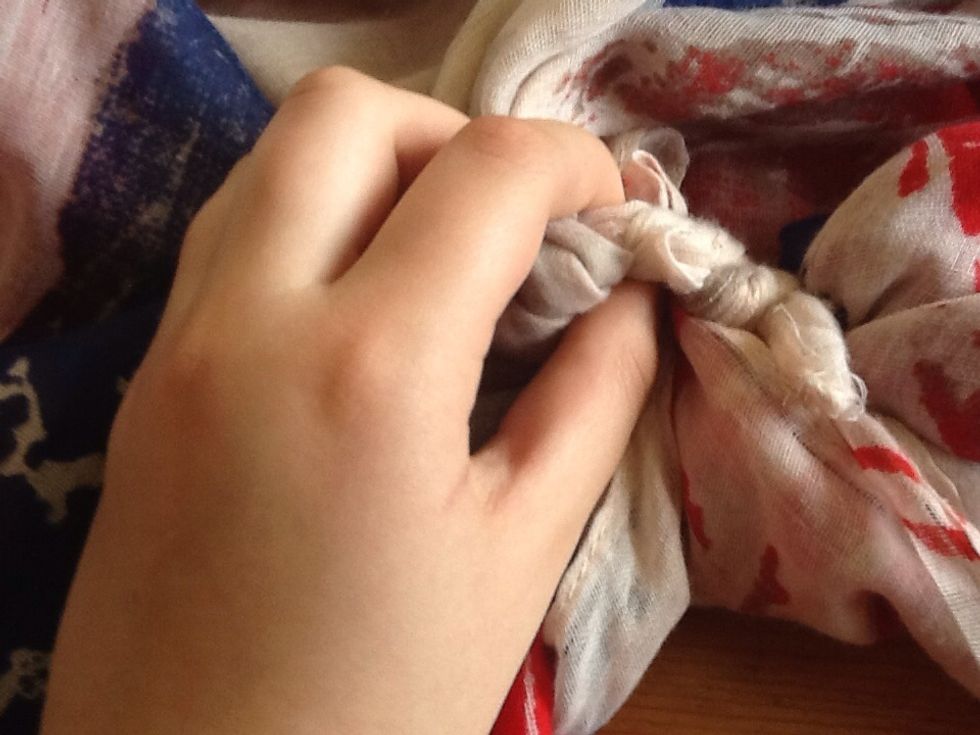 Pull it through the second knot.