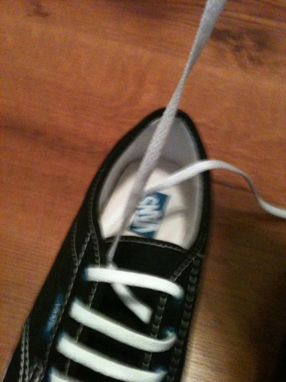 Pull it trough the top of the last hole left and you have tied your shoelaces into bars! \ud83d\ude03 If you have more hole than I did (I have five) just follow the same pattern \ud83d\ude01