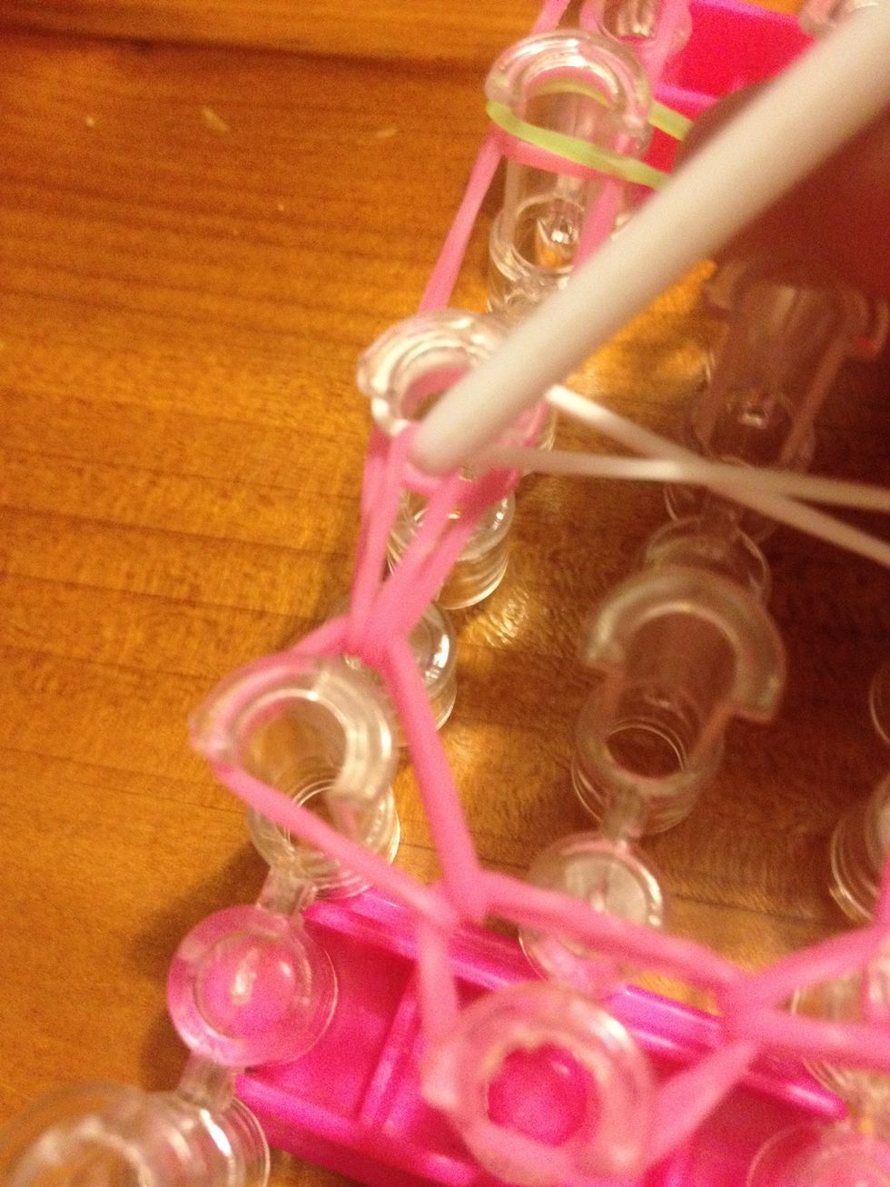 Pull It up and through and take it back onto itself on the 3rd left hand pin