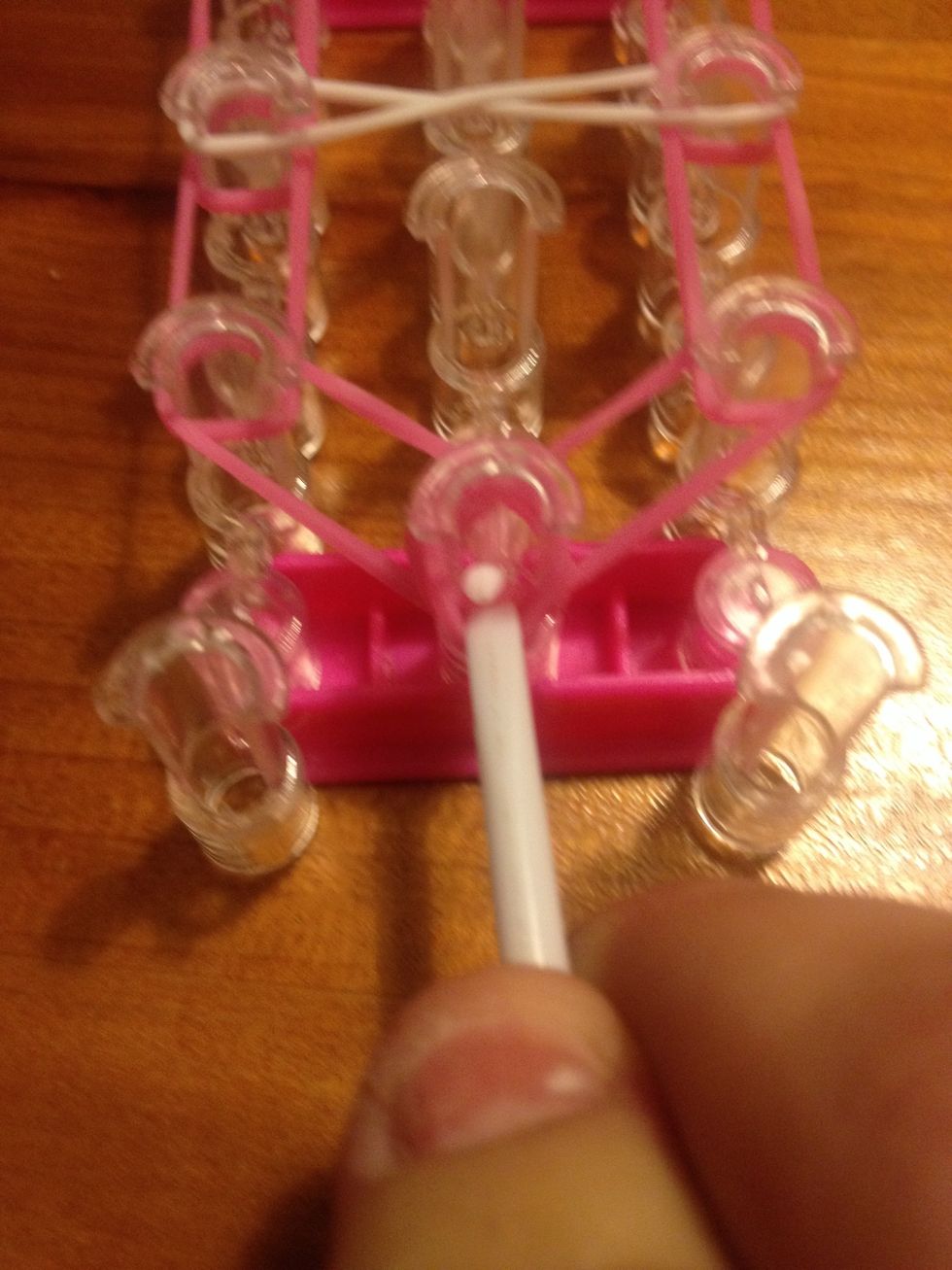 Pull it up through the cap band