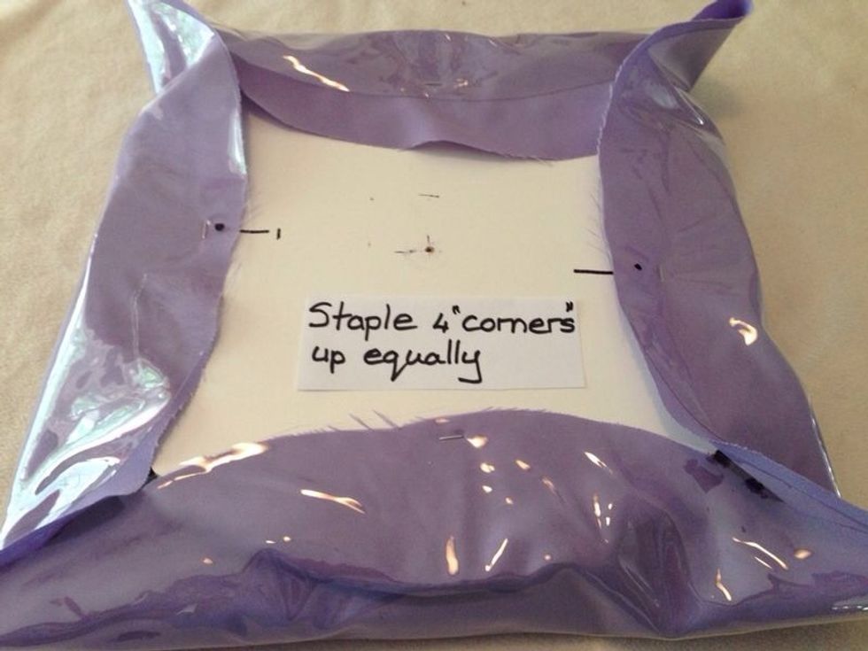 Pull material & plastic fairly firmly & staple on opposite sides.