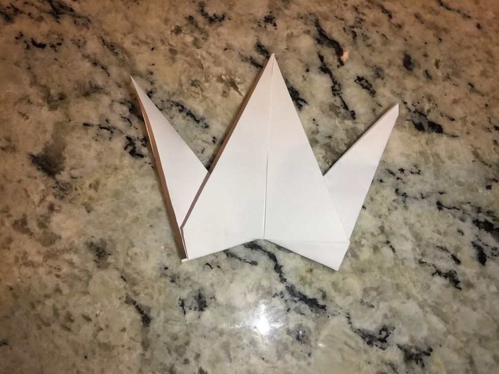 Pull middle triangles out on both sides to create head and tail