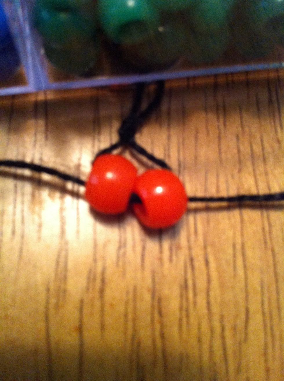 Pull on both the strings, moving upwards. You should have this