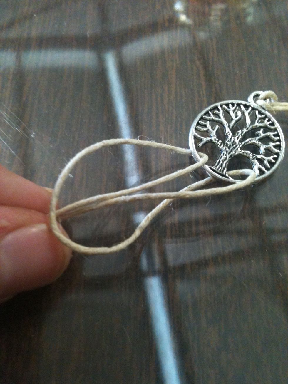 Pull on it and stick it through the loop