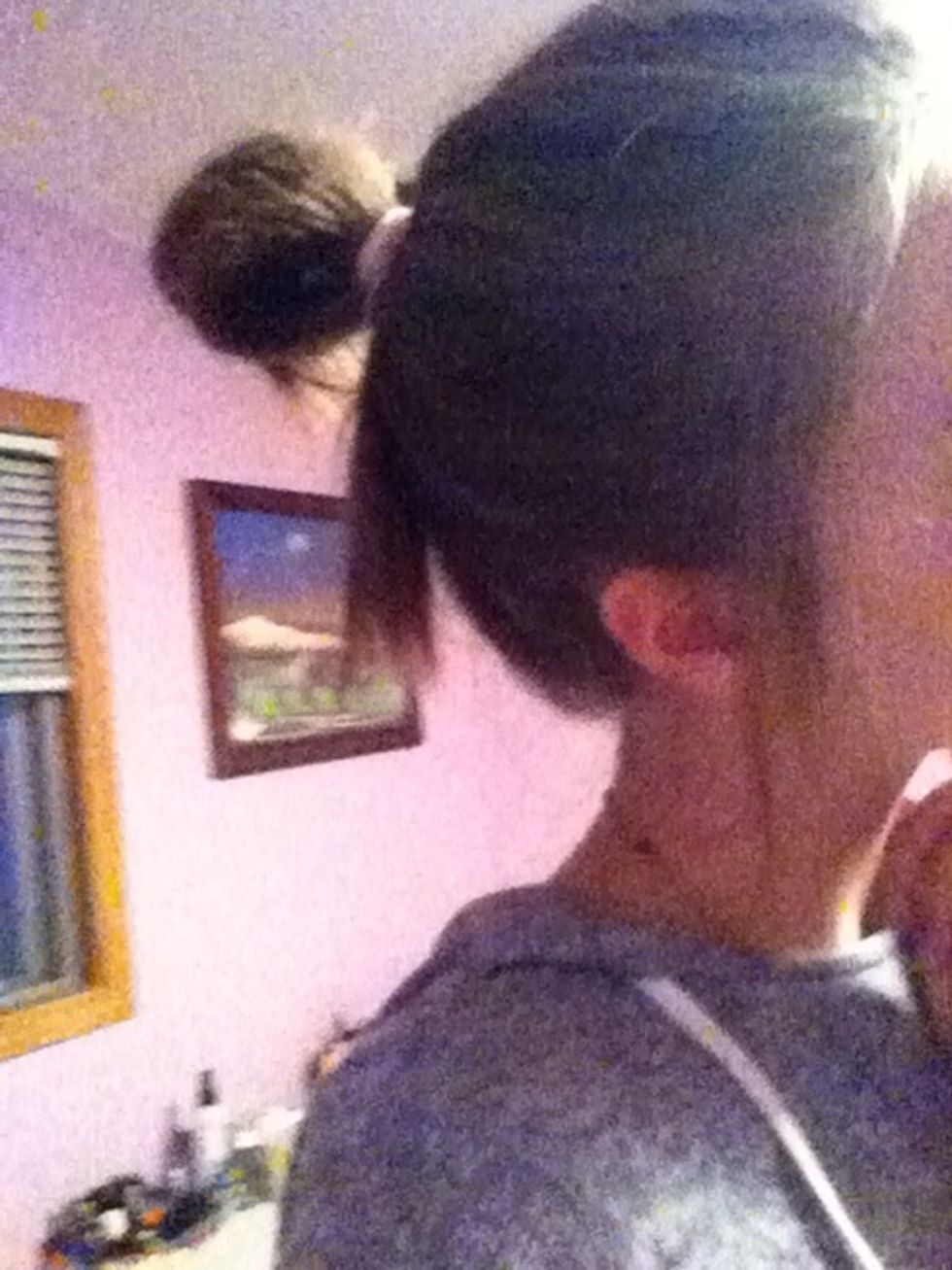 Pull on your hair to make it a bit looser and messier