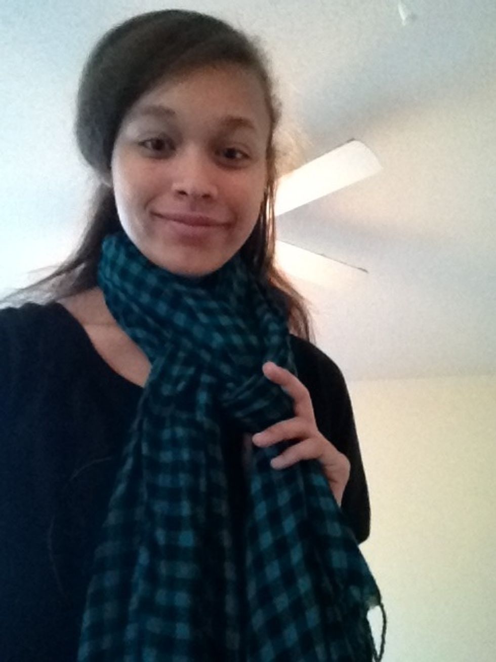 Pull one of the tails through the gap between the other tail and the loop, like so.