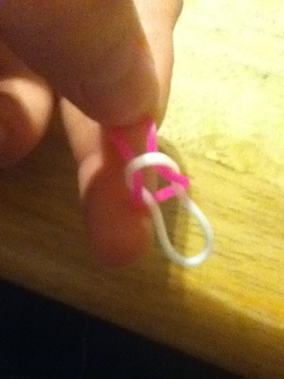 Pull one side of band into the other to...