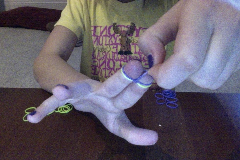 pull one side of the rubber band upend over (do that to the outher side of the rubber band)