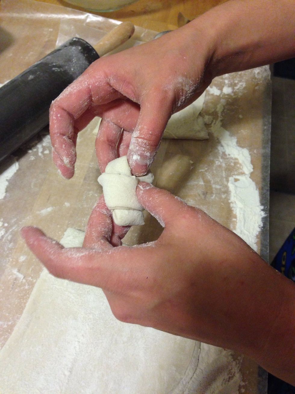 Pull one side under.